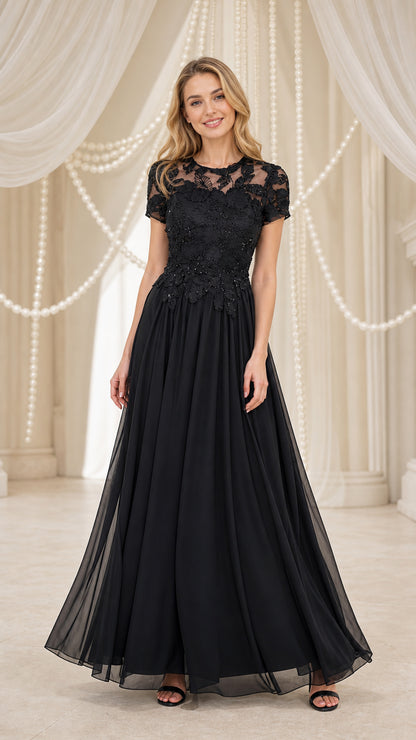 Model wearing black lace applique chiffon evening dress, front view