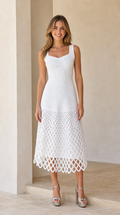 Front view of woman wearing white sleeveless square neck open-knit midi dress with metallic heels