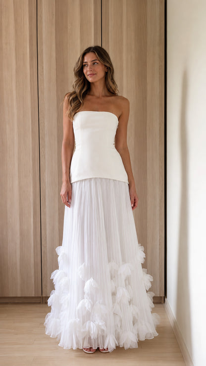 Front view of woman wearing white strapless 3d floral tulle maxi dress