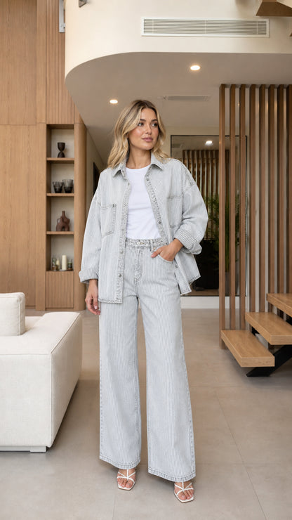 Front view of model wearing Light Blue striped denim shirt jacket and wide-leg pants set
