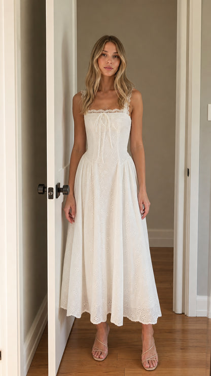 Front view of woman wearing white square neck eyelet midi dress