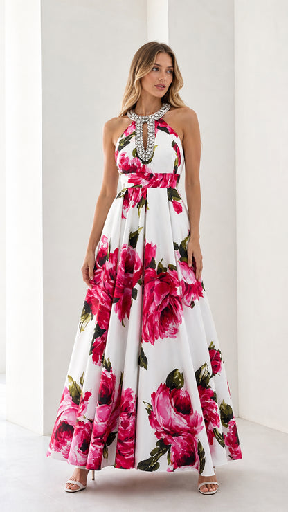 Front view of woman wearing white floral long dress with crystal halter neck