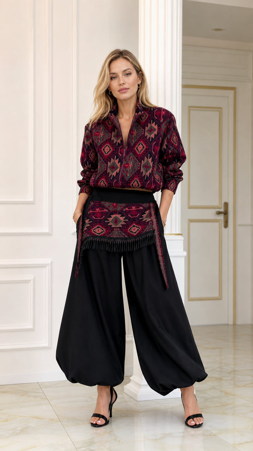 Front full view of woman wearing burgundy geometric print blouse and black balloon pants set