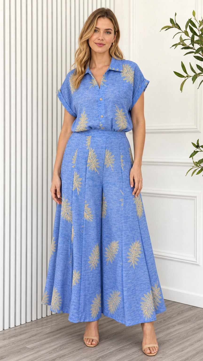 Front view of model wearing blue leaf print two piece set