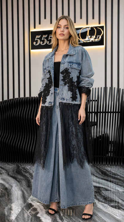 Front view of model wearing blue denim long jacket with black lace and matching wide leg pants