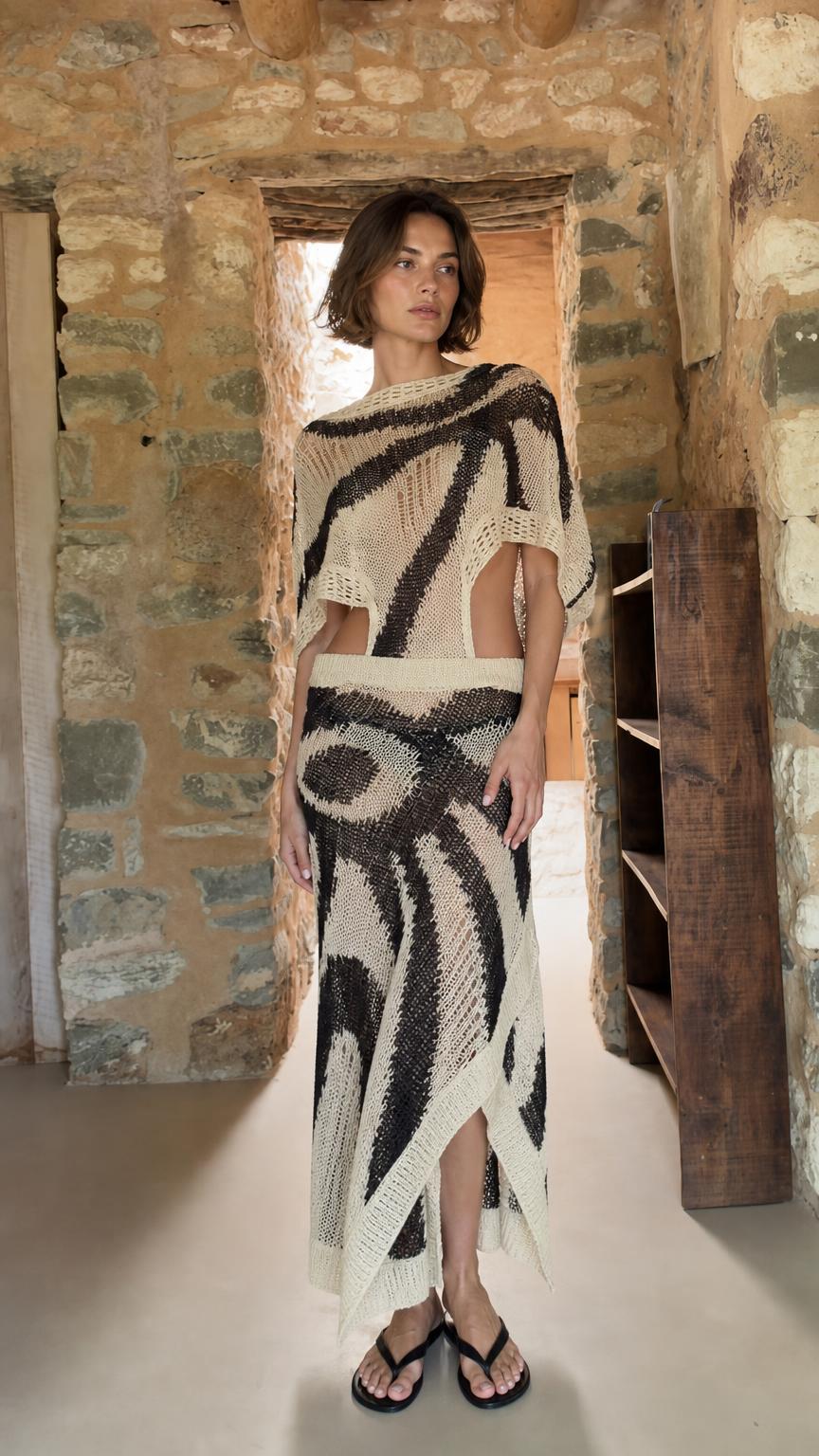 Model wearing ivory open-knit two-piece maxi set from the front