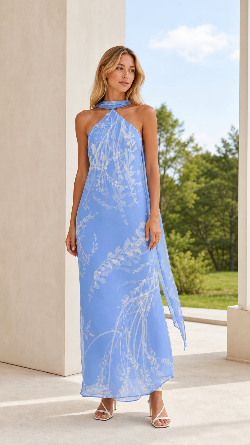 Front view of model wearing light blue floral halter maxi dress