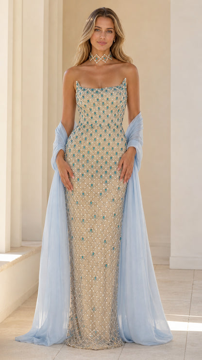 Front view of champagne crystal embellished evening gown with blue shawl