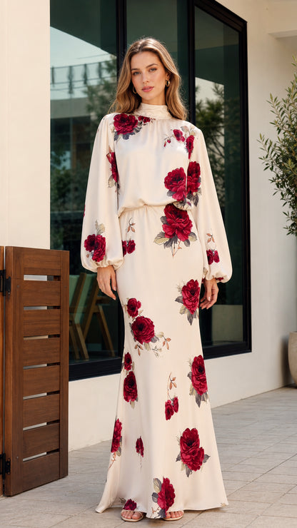 Full-length front view of woman wearing cream floral print high-neck maxi dress with long bishop sleeves