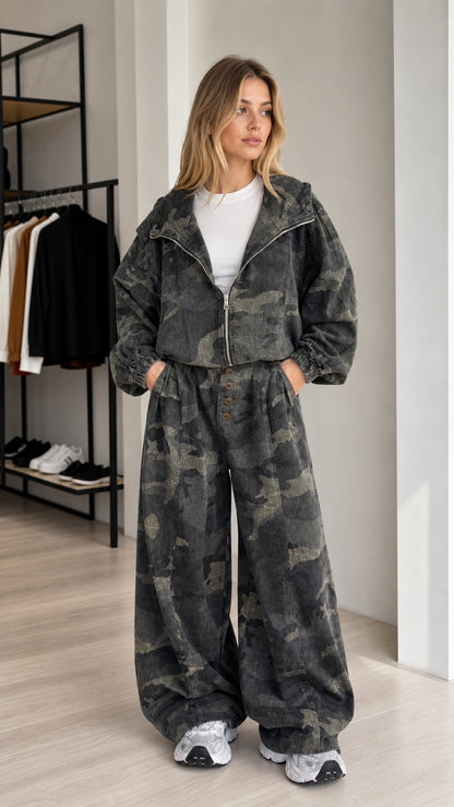 Front view of a woman wearing the charcoal camouflage cropped jacket and wide-leg pants set