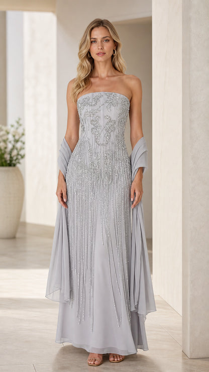 Front view of model wearing dusty blue strapless embellished evening gown with matching shawl