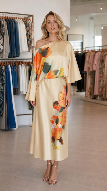 Front view of model wearing champagne one-shoulder floral satin midi dress