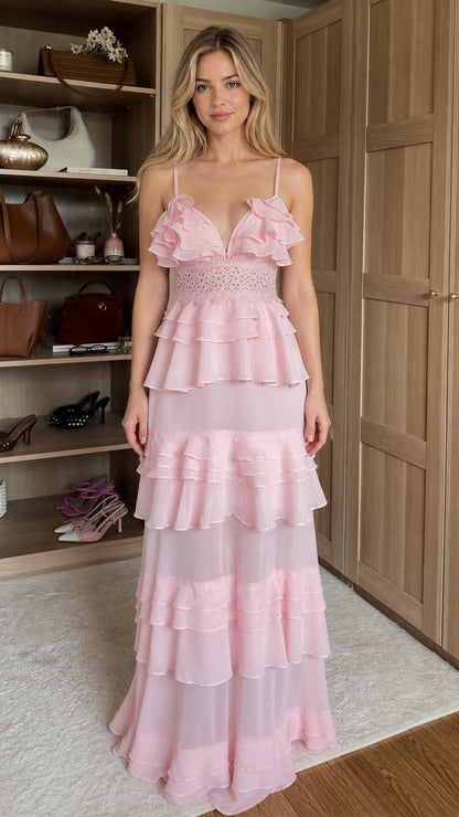 Front view of model wearing pink ruffled tiered maxi dress