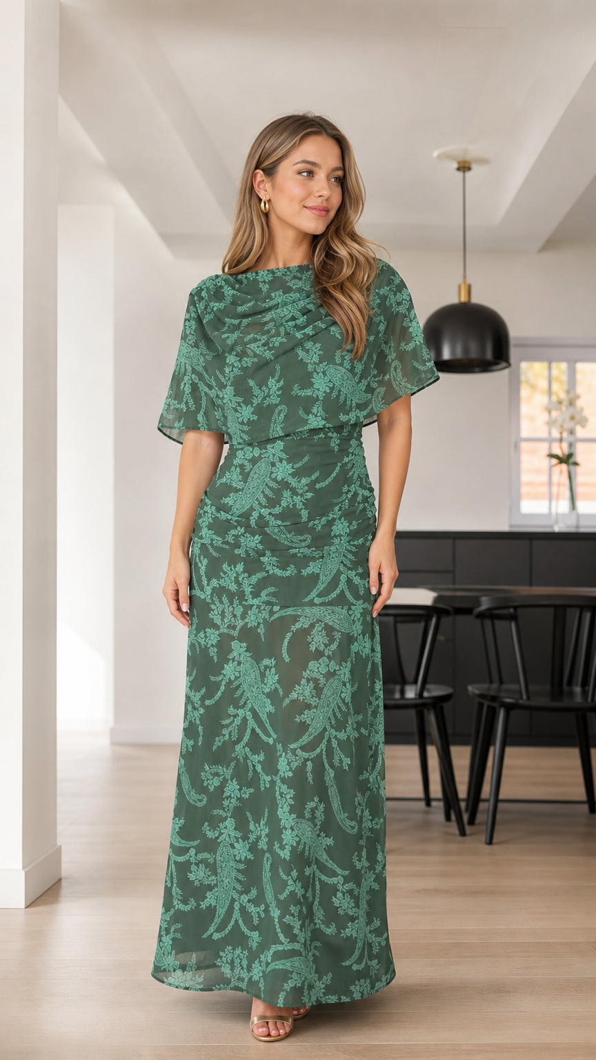 Front view of woman wearing Forest Green floral textured capelet maxi dress