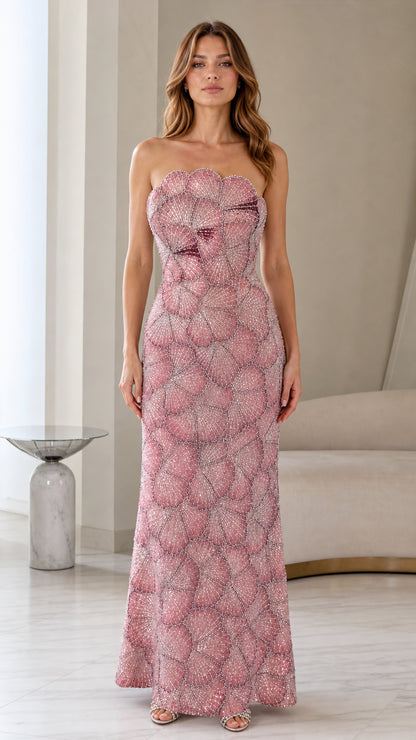 Front view of woman wearing strapless embellished dusty rose maxi evening gown