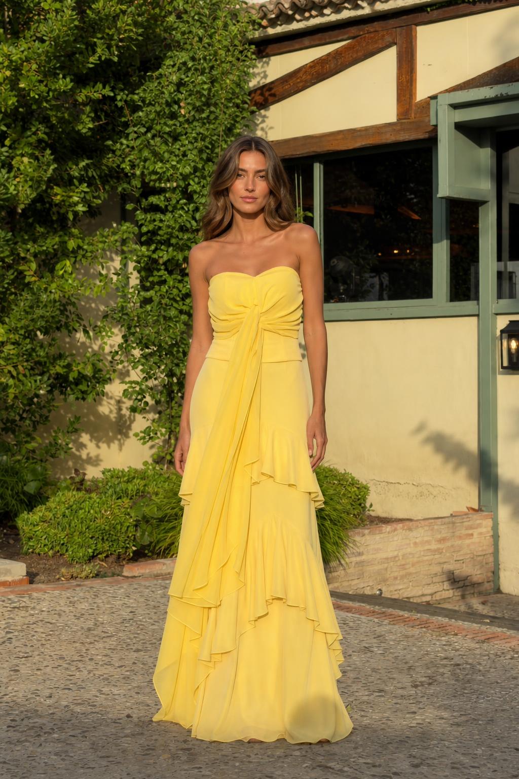 Front view of yellow strapless ruffled maxi dress