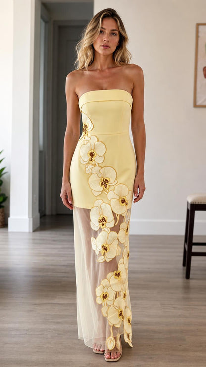 Front view of yellow strapless 3d floral maxi dress