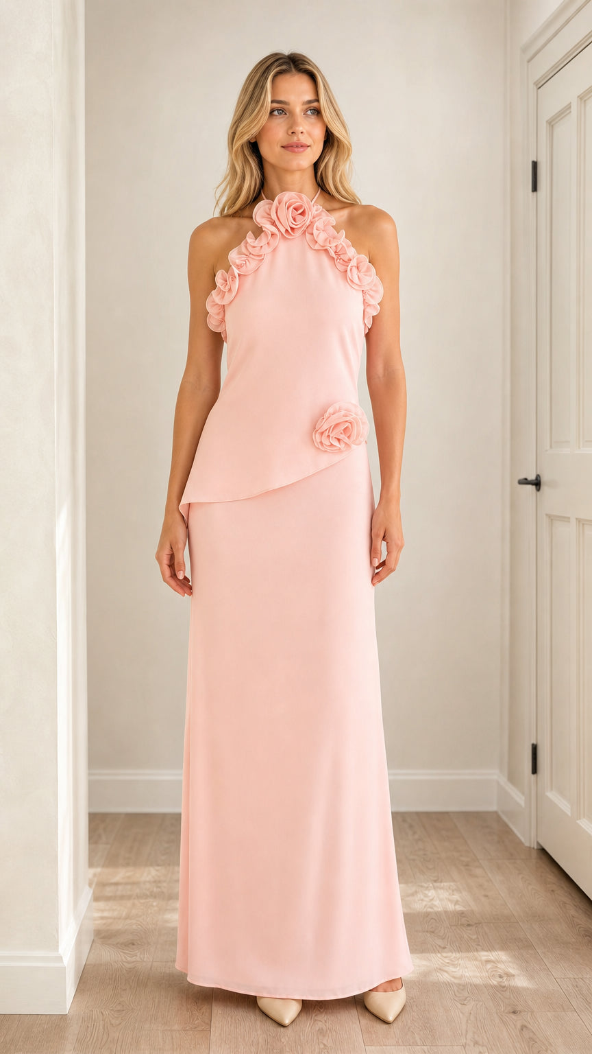 Front view of model wearing pink 3D floral halter maxi dress