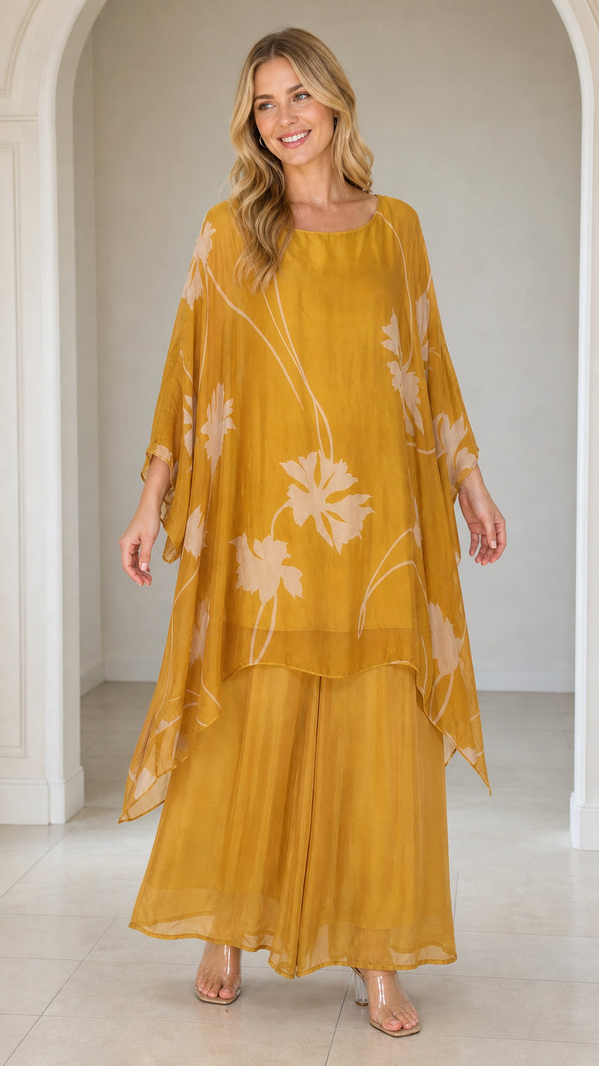 Front view of woman wearing mustard yellow floral kaftan set