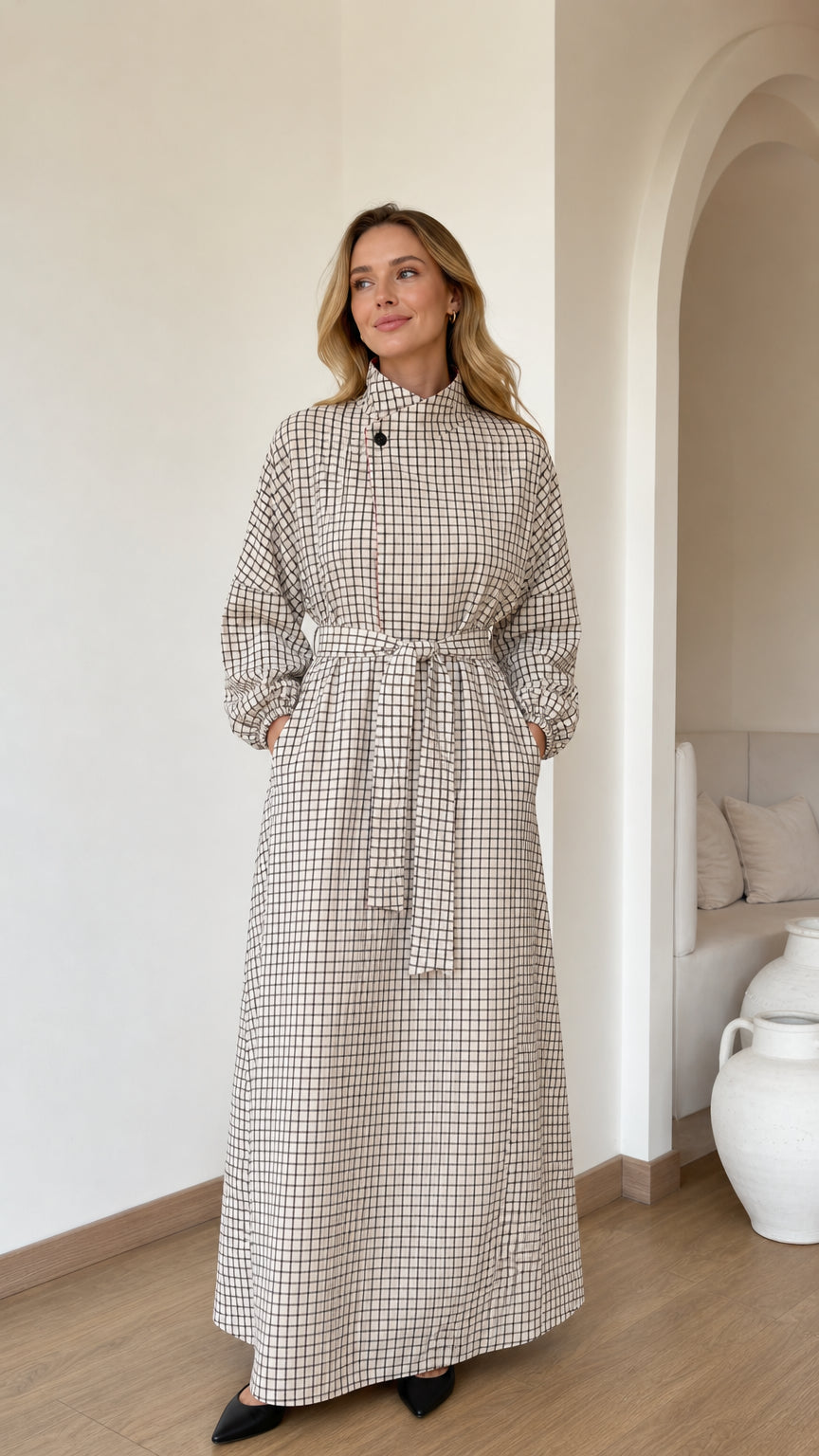 Front full view of woman wearing Cream grid check high neck maxi dress with waist belt
