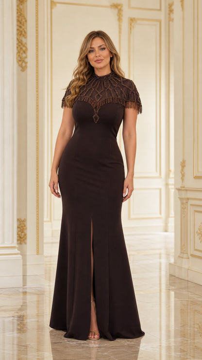 Front view of model wearing Chocolate Brown mock neck beaded capelet evening gown with front slit