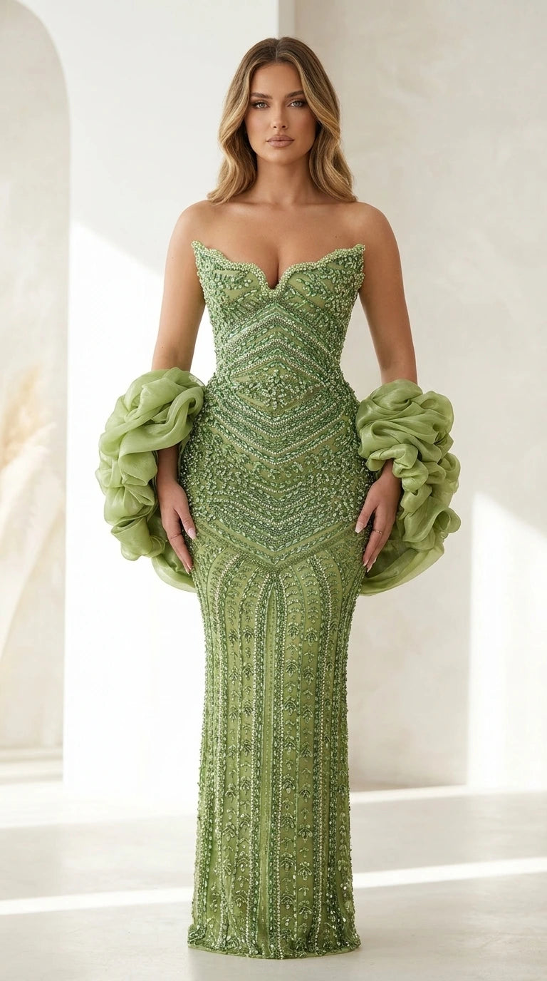 Front view of sage green beaded strapless evening gown with ruffled sleeves