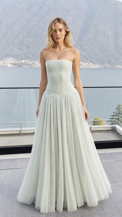Front view of model wearing sage green strapless corset tulle maxi dress