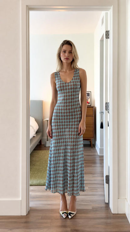 Front view of model wearing blue argyle sleeveless midi dress
