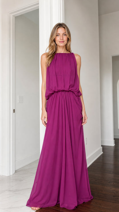 Front view of woman wearing magenta sleeveless high neck blouson maxi dress