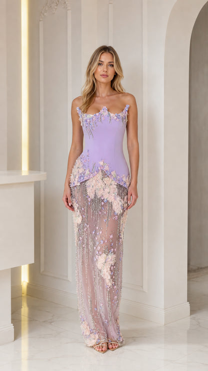 Front view of model wearing lavender embellished strapless gown