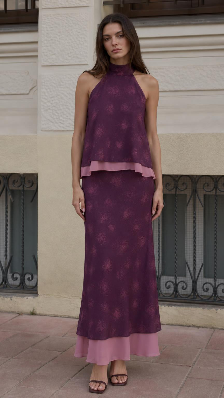 Front view of model wearing purple halter neck top and maxi skirt set