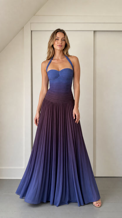 Front view of model wearing blue ombre ruched halter maxi dress