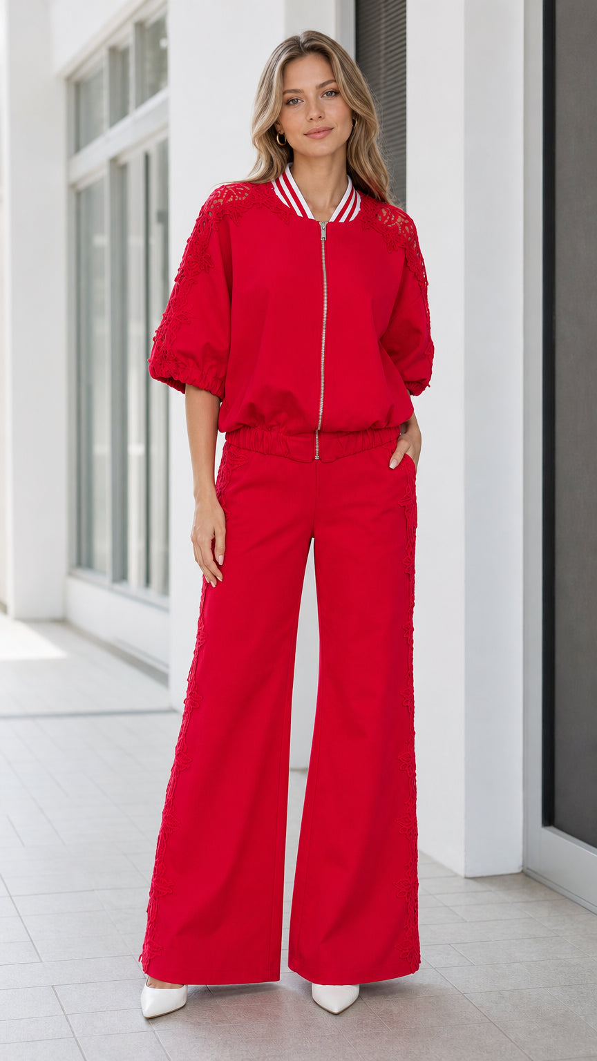 Front full view of women's red lace-detailed zip-up bomber jacket and wide-leg trousers set