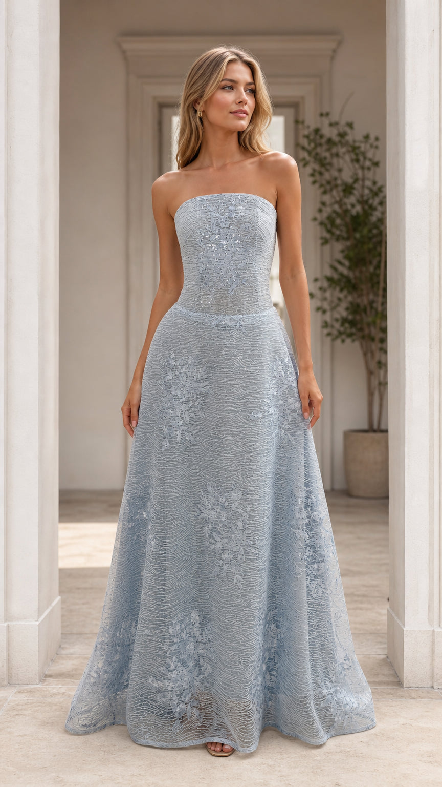 Front view of model wearing light blue strapless formal evening dress