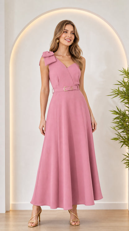 Front view of woman wearing pink bow shoulder maxi dress