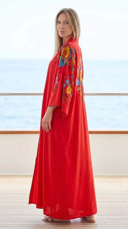 Model wearing red floral embroidered maxi kaftan dress, side view