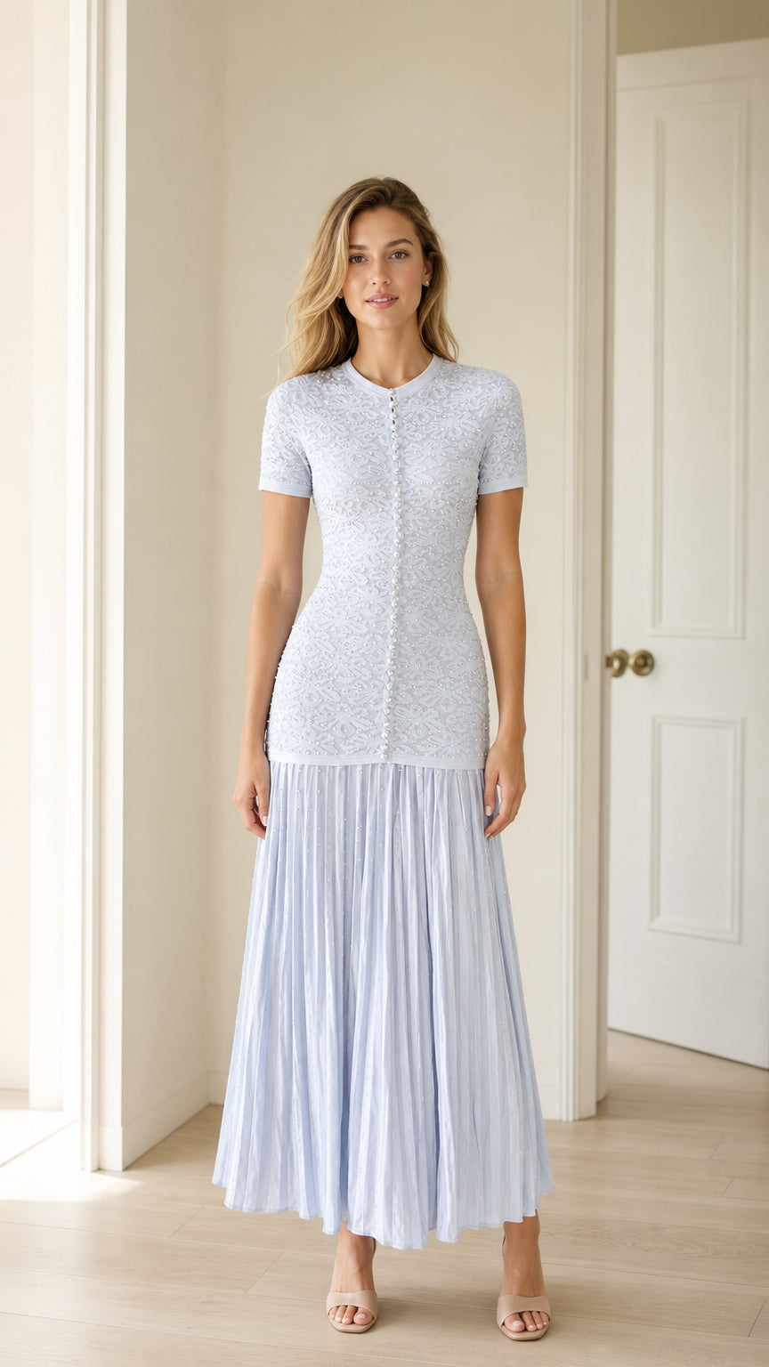 Front view of light blue pearl button knit bodice pleated midi dress