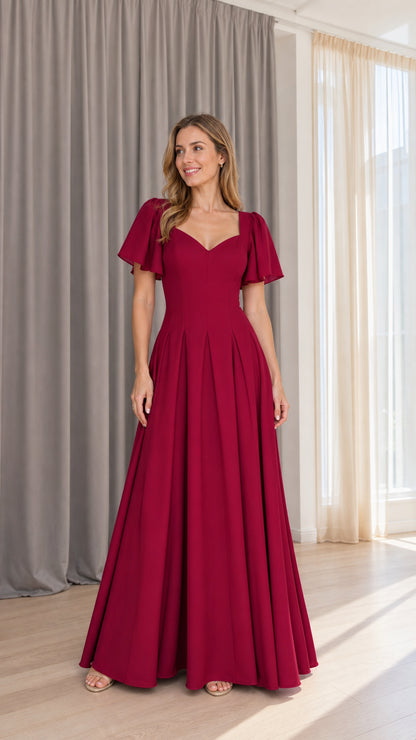 Front view of model wearing burgundy square neck maxi dress