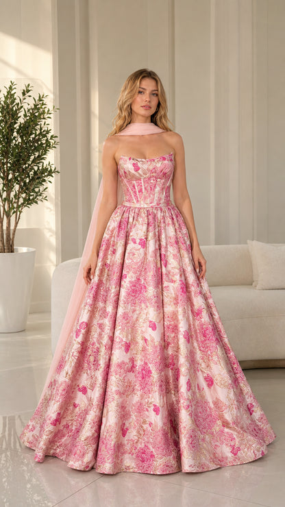 Front view of model wearing pink floral strapless ball gown with matching scarf