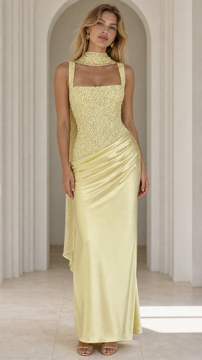 Front view of yellow sequin bodice satin draped maxi dress