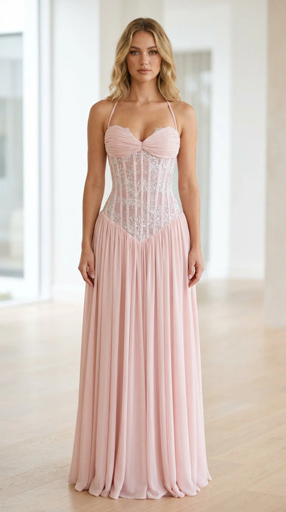Front view of pink halter neck sequin corset long dress