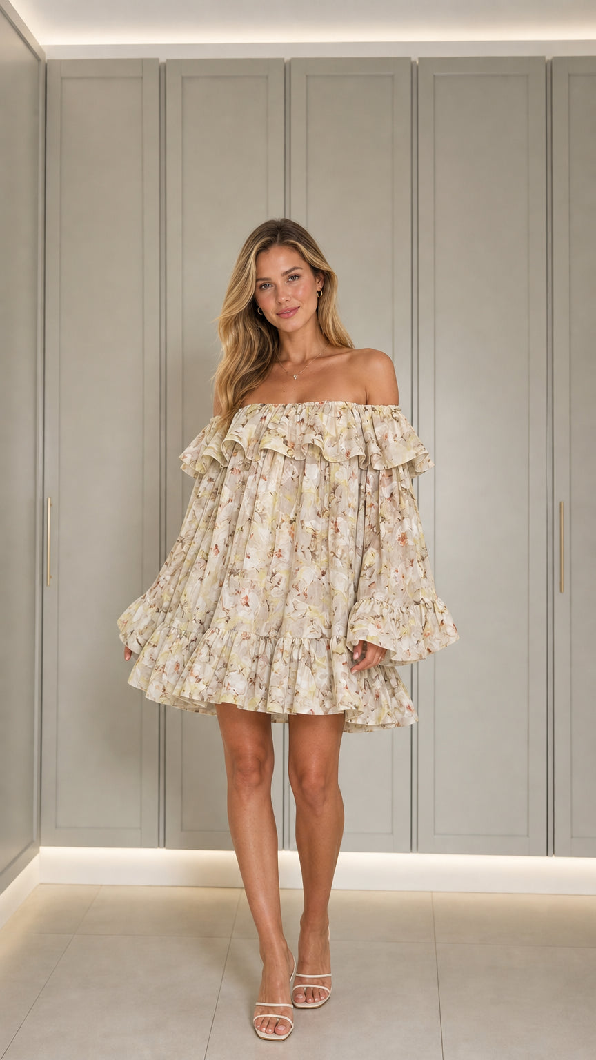 Front view of model wearing beige off-shoulder floral mini dress