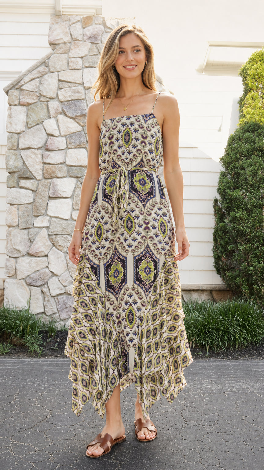 Front view of model wearing cream boho print midi dress with spaghetti straps