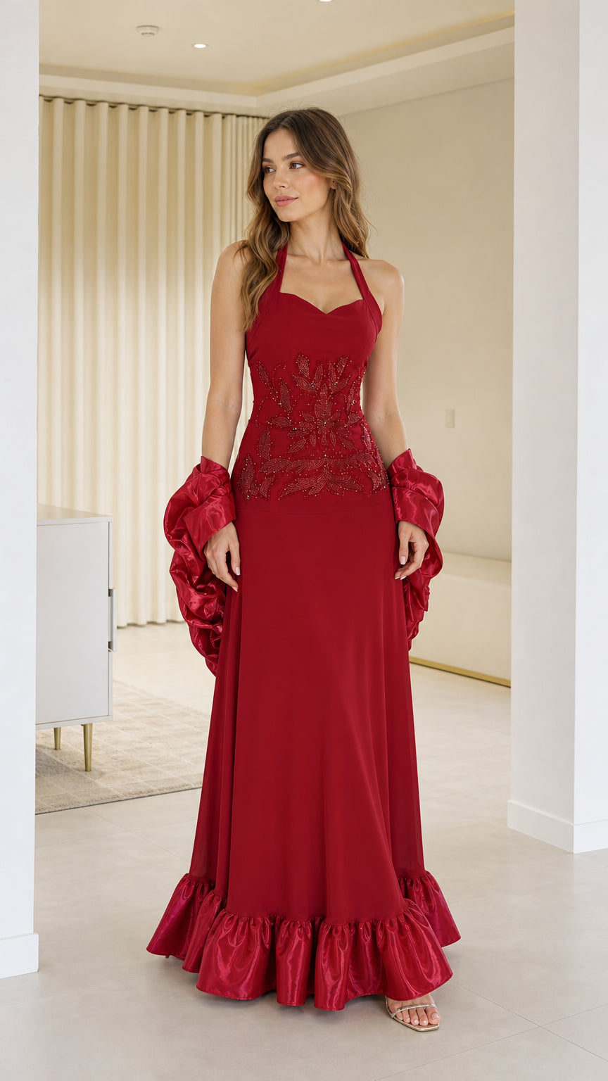 Front view of woman wearing red halter neck evening dress with shawl
