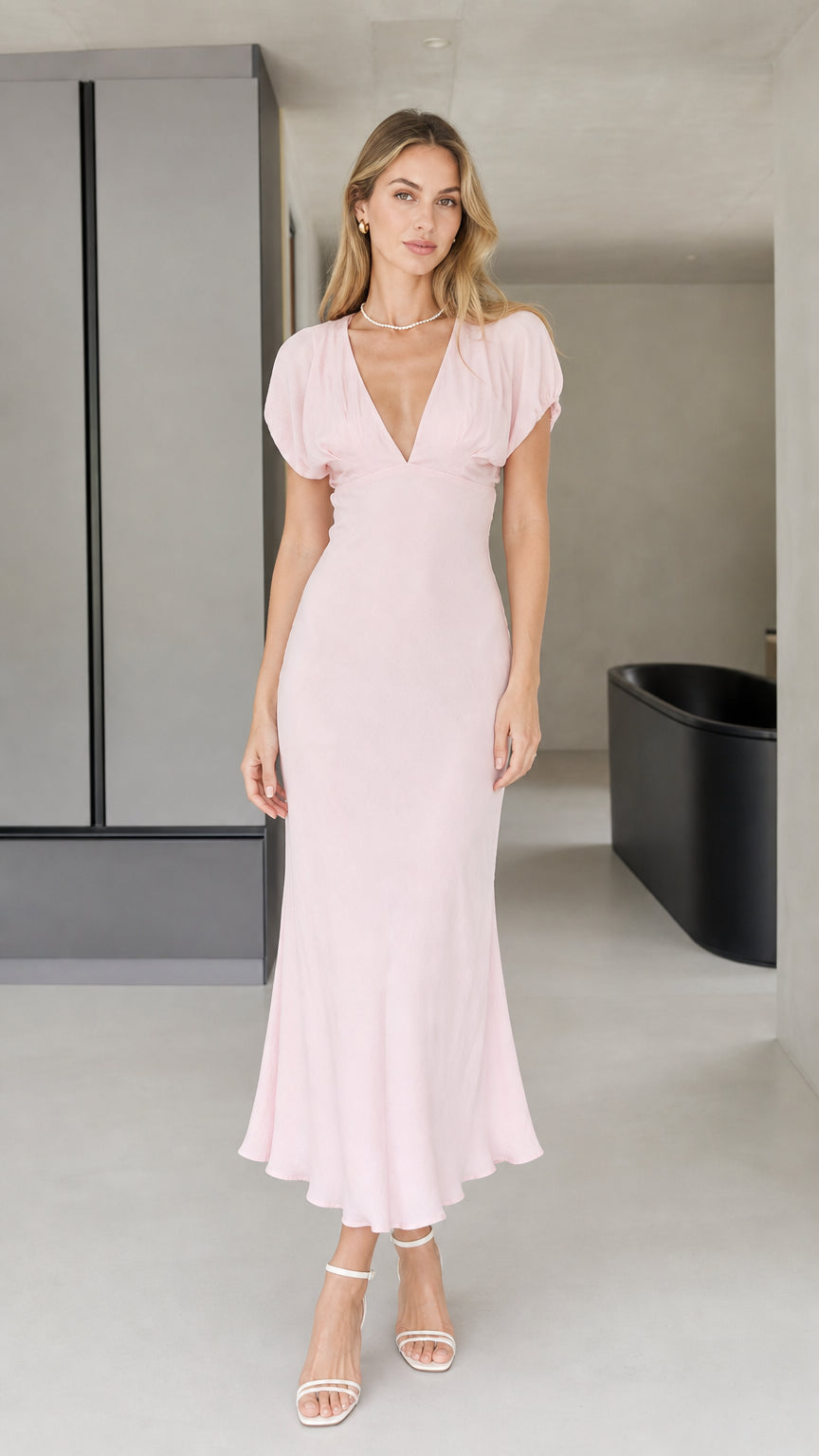 Front view of model wearing pink v-neck midi dress