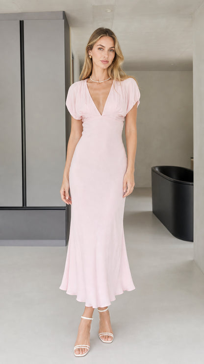 Front view of model wearing pink v-neck midi dress