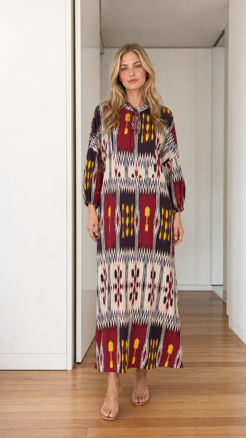 Front view of burgundy printed long sleeve maxi dress