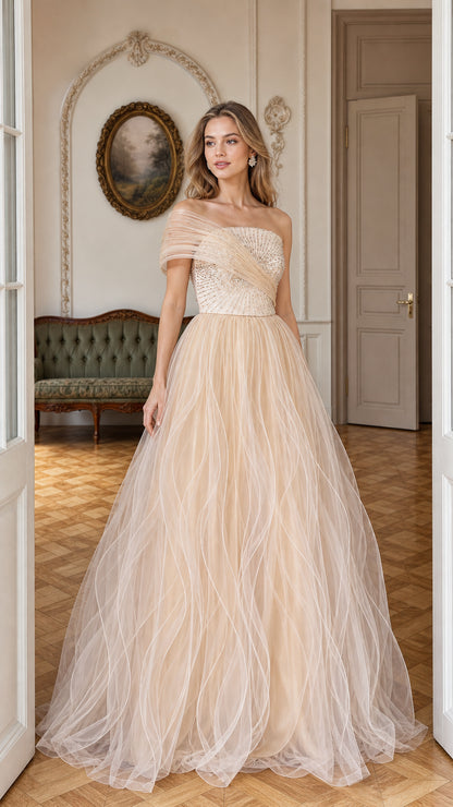 Front view of model wearing champagne sequined pleated tulle formal gown