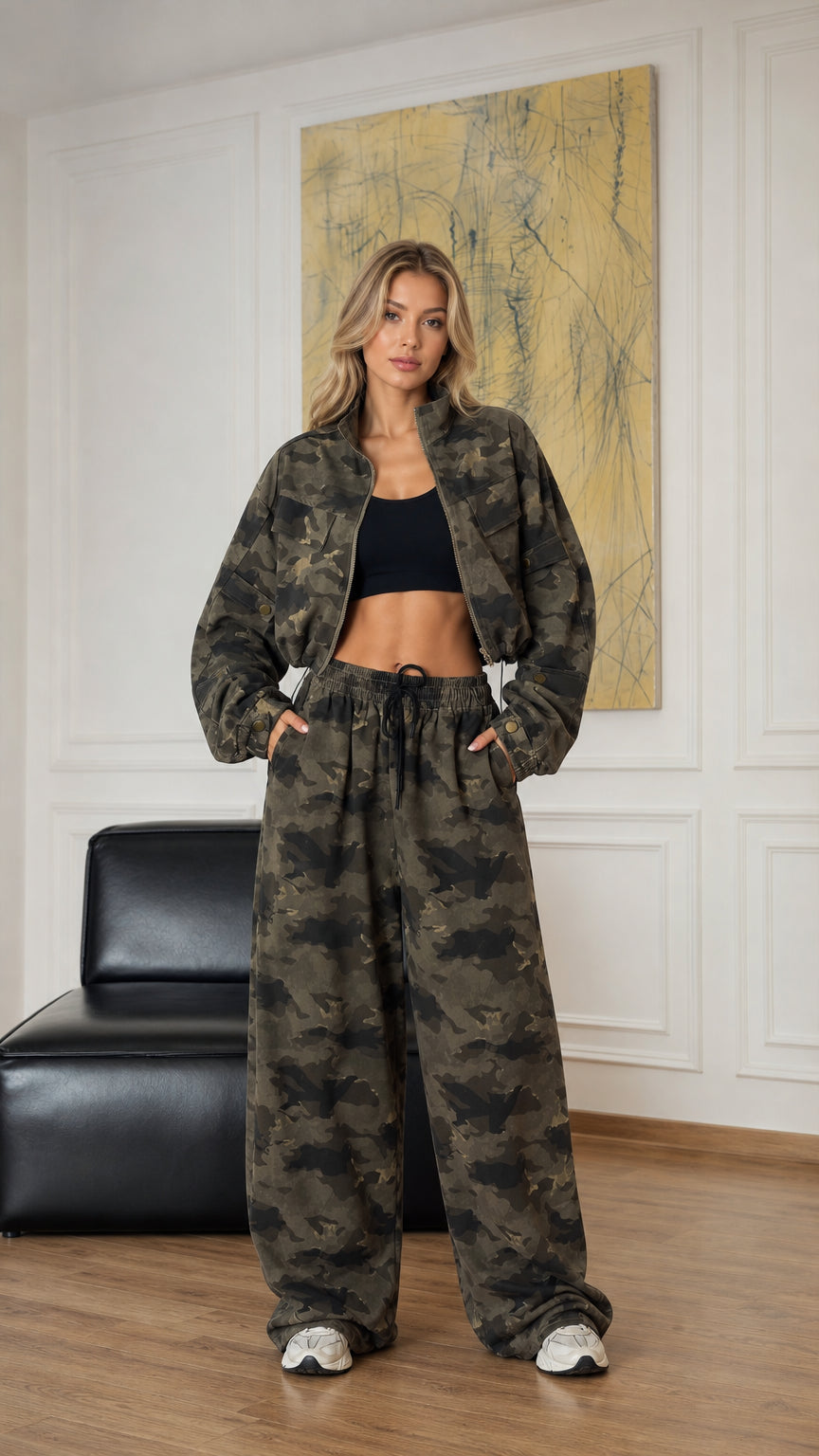 Front view of model wearing army green camouflage cropped zip jacket and wide-leg pants set
