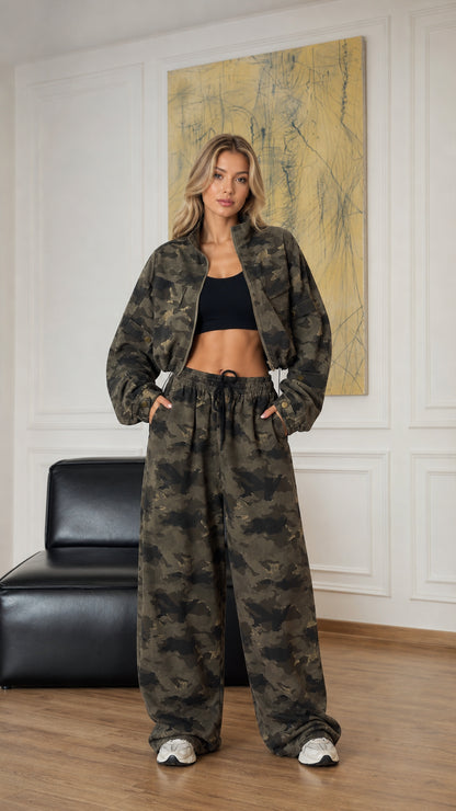 Front view of model wearing army green camouflage cropped zip jacket and wide-leg pants set